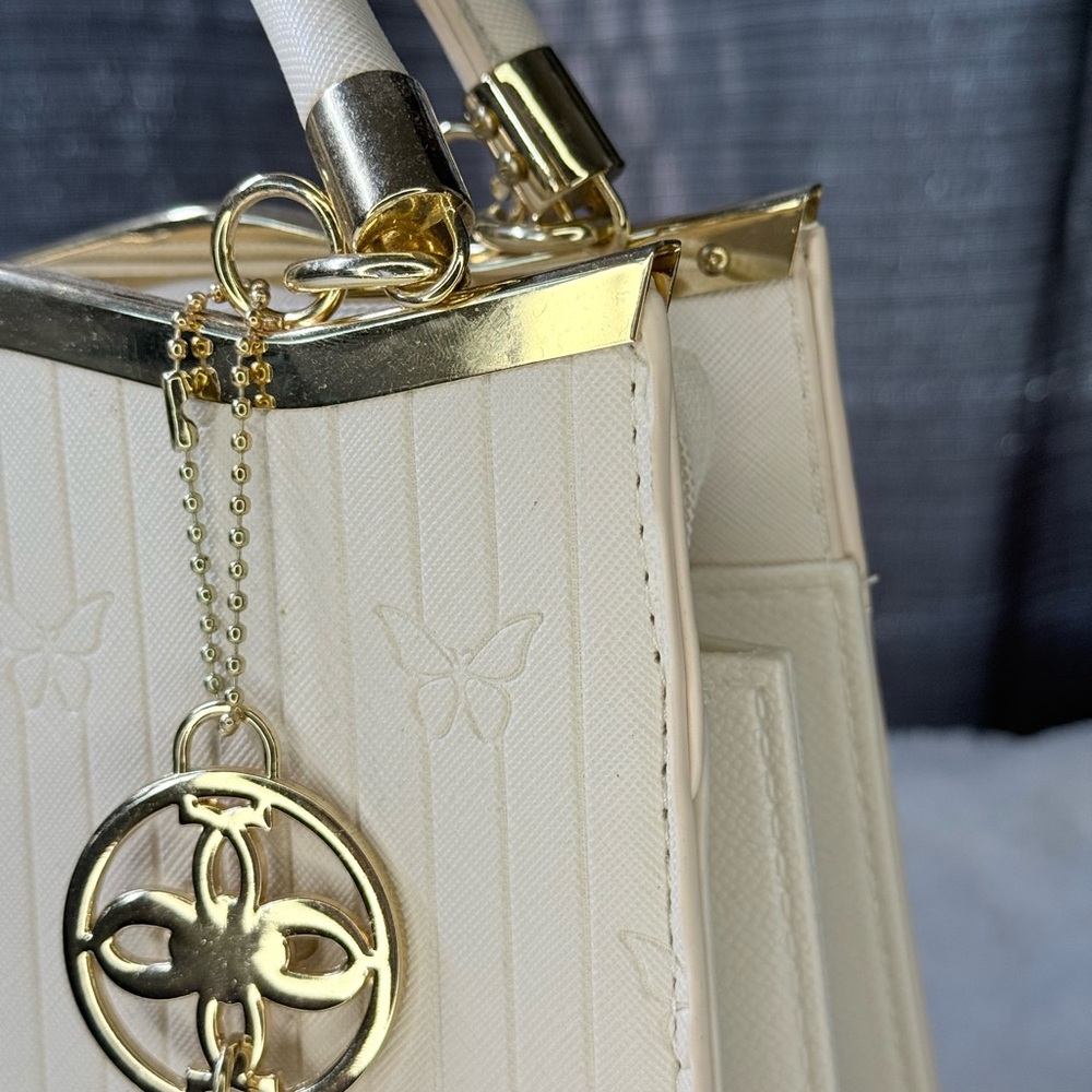 Elegant Cream Handbag with Gold Accents